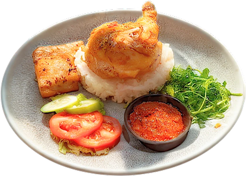 Ayam penyet pica-pica: chicken leg on rice with tomato and cucumber
